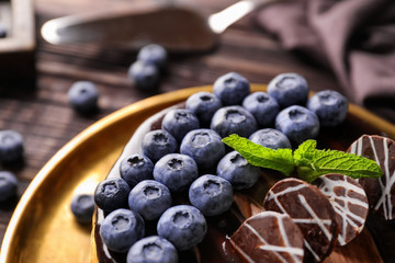 Metal tray with blueberry chocolate cake, closeup