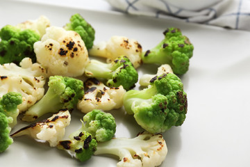 Plate with colorful cauliflowers, closeup