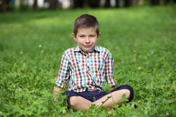 Cute little boy in park on summer day