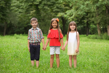 Fototapeta premium Cute little children in park on summer day