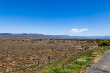 The dry and arid farms and landscape of the Karoo in the Northern Cape, South Africa.