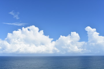 Naklejka na ściany i meble Clouds over the ocean