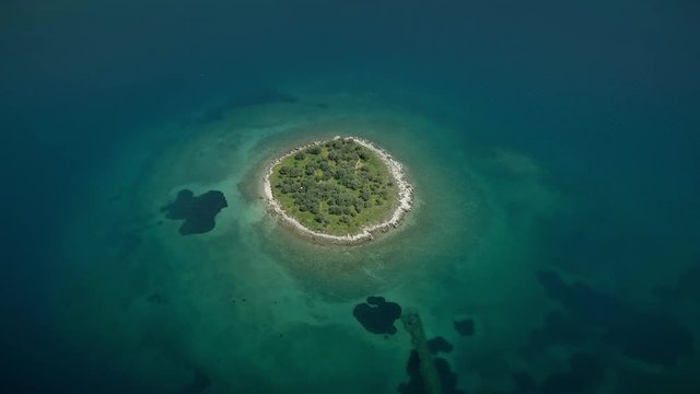 Aerial view of the St. Athanasios island in the Gulf of Corinth, Greece.