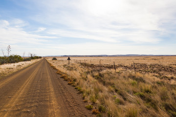 Fototapeta na wymiar Dirt roads and fields of the Karoo near Gariep dam, South Africa.