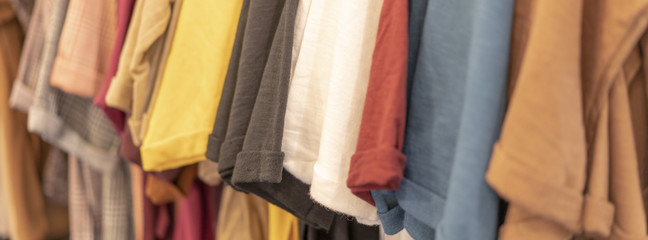 Color full stack of  t-shirt in shopping mall or department store.