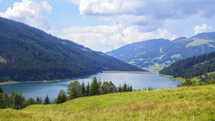 Naklejka na ściany i meble View on the lake between mountains