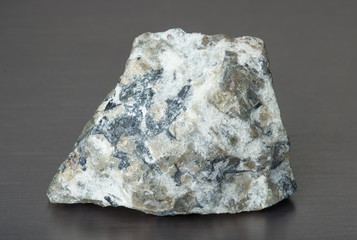 Specimen of mineral apatite on gray background