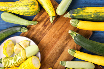 Frame made of fresh zucchinis on board