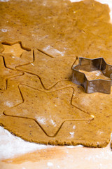 Preparing Christmas gingerbread cookies. Gingerbread dough and star shape cookies ingredients.