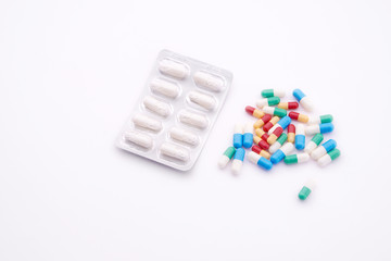 Blister pack and medicine on white
