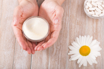 Collagen protein powder with spoon measure isolate on white background.