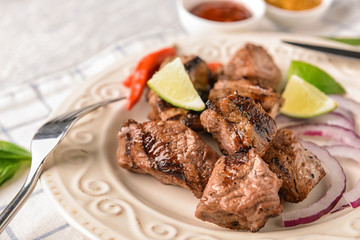 Delicious shish kebab on plate, closeup