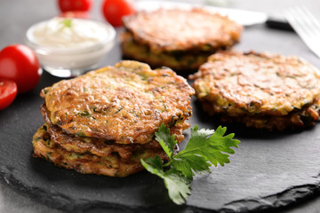 Zucchini pancakes on slate plate