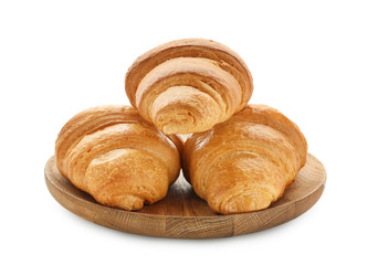 Plate with tasty croissants on white background
