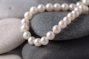 Pearls a necklace on stone