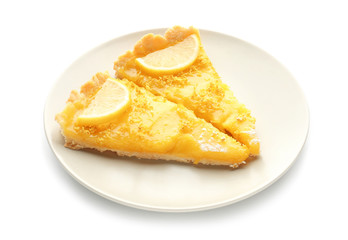 Plate with pieces of delicious lemon pie on white background
