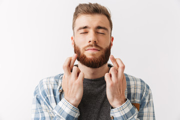 Portrait of a worried young bearded man standing
