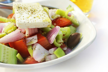 Greek salad with fresh vegetables feta cheese, cucumber,pepper,tomatos and black olives. Vegan food. Healthy food.