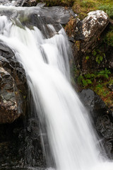 Fototapeta na wymiar Waterfall small, with ferns and rocks