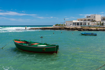 Fototapeta premium Enchanted sea. Boats in the bay of the abbey of San Vito
