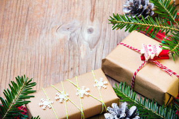 Christmas presents on wooden background, retro style with copy space