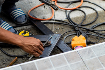 The workers are welding steel in Thailand.