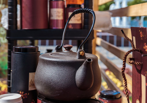japanese herbal tea prepared in brown cast iron teapot