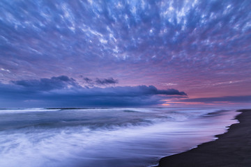 Las Machas Beach. Clouds with the last sunrays impacting over it creating an amazing palette on an...