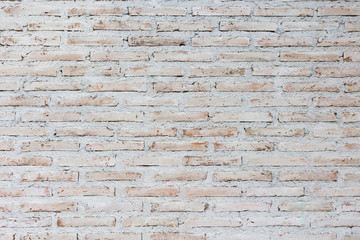 white and brown brick wall background in rural room, Background of old vintage dirty brick wall with peeling plaster, texture .
