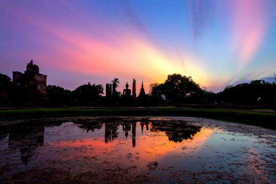 Ancient buddha statue at sunset. Sukhothai Historical Park, Sukhothai Province, Thailand
