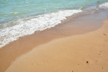 Beautiful sea wave on the sand beach with copy space.