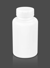 white plastic bottle for supplement product isolated on gray background