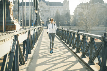 Young woman running in the city