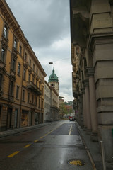 LUGANO, SWITZERLAND - APRIL 2013; A street with touristic shops and cafe