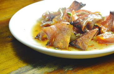 roasted pork ear slice dressing spicy sauce on plate