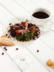 Traditional italian tiramisu in martini glass