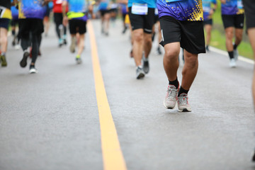 Group of people running race marathon