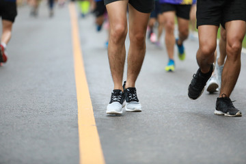 Group of people running race marathon