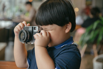 boy taking photo like professional