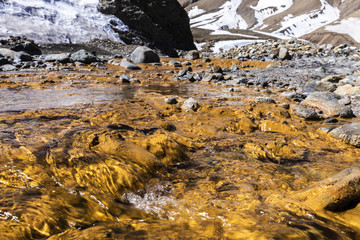 Hot spring waters at Andes mountains in Termas del Plomo at Central Andes in Santiago de Chile an amazing mountain landscape full of colors