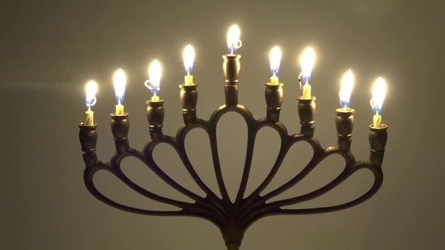 Jewish Hanukkah with burning candles in motion - judaica simbol for Hanukkah