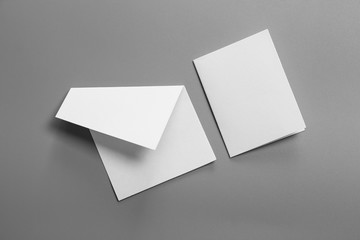 Blank portrait A4. brochure magazine isolated on gray, changeable background / white paper isolated on gray