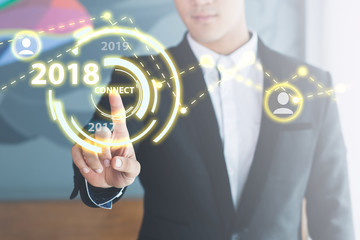 businessman pressing a 2018 year start button happy success celebration. New year a future part