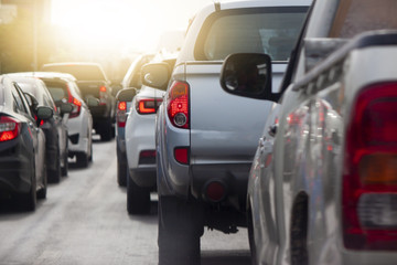 Cars break on the road heading towards the goal of the trip but stop in junction by traffic light control.