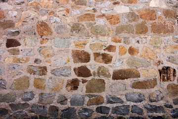 Colorful Stone Wall with Black Base