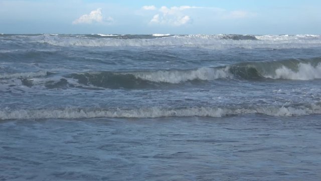 Waves rolling on the beach is a stormy day, winter mediterranean sea. Focene, Lazio, Italy. 4k