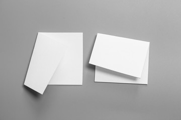 Blank portrait mock-up paper. brochure magazine isolated on gray, changeable background / white paper isolated on gray