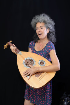 Woman oud instrument Dog companion