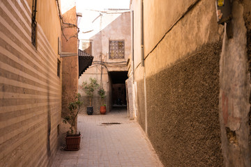 old empty alley in historic medina in marrakesh, morocco