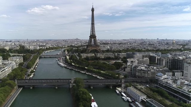 Aerial footage moving slowly towards Eiffel Tower is a wrought iron lattice structure on Champ de Mars in Paris France the building is named after the engineer whose company designed and built it 4k